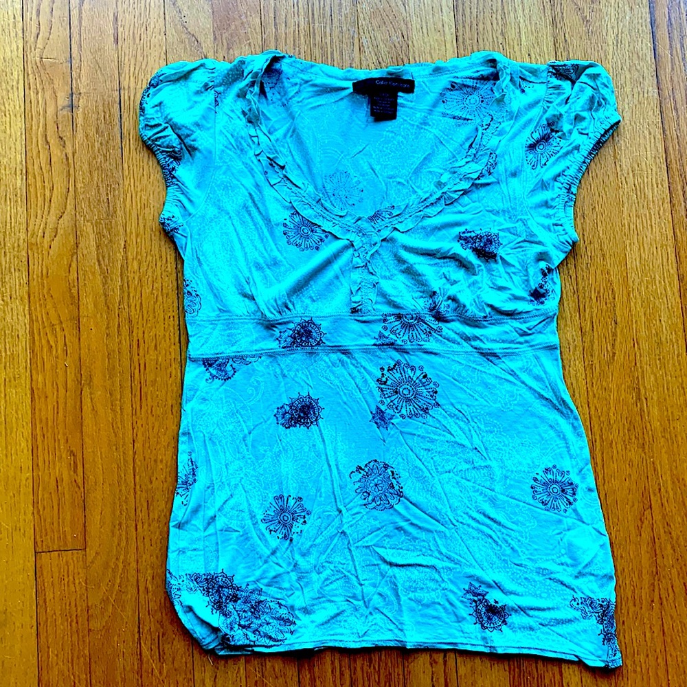 Light turquoise stretchy top. Small. Calvin Klein. Cute design. Flattering.